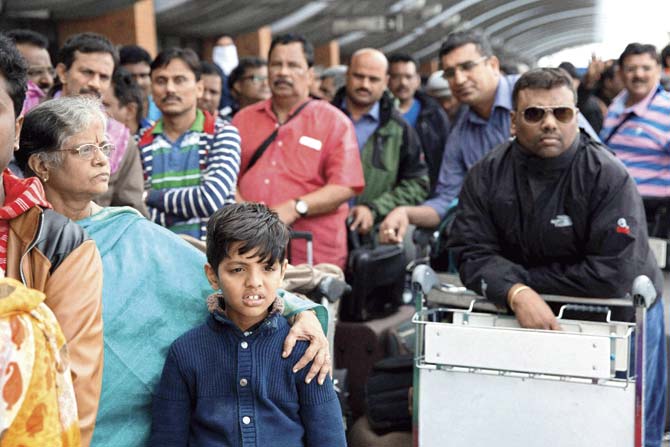 Indian nationals queue outside Kathmandu Airport yesterday. Rescue operations continued yesterday, following the earthquake on Saturday. Pics/PTI