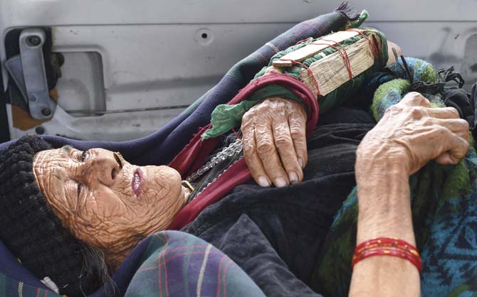A Nepalese resident injured in the earthquake waits in an ambulance after being rescued from a village at Pokhara airport yesterday. Pic/AFP