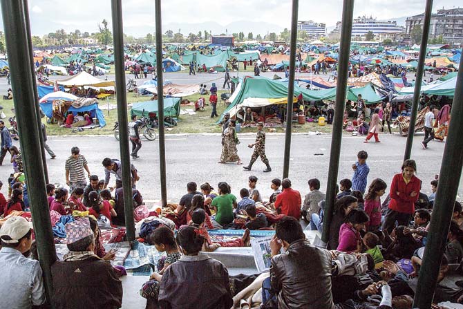 Thousands of residents take shelter in an evacuation camp set up at Tundikhel park in Kathmandu. Pics/Getty Images