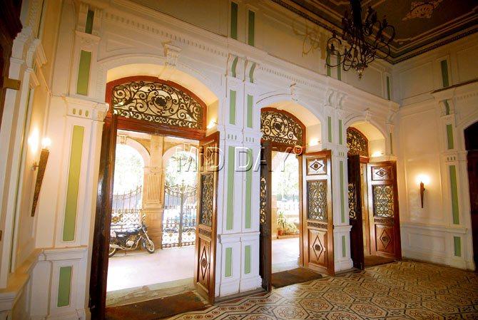 The main entrance. Three Burma teakwood doors and Roman mosaic floor tiles greet the visitor