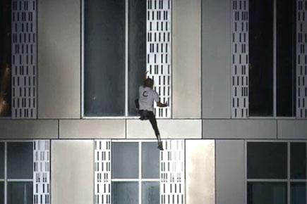 French 'Spiderman' climbs world's highest twisted tower