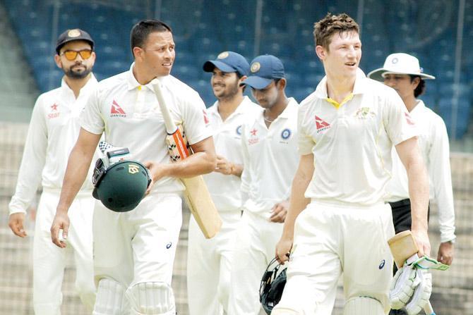 Australia ‘A’ openers Usman Khawaja (left) and Cameron Bancroft are delighted after beating India ‘A’ in Chennai on Saturday. Pic/BCCI