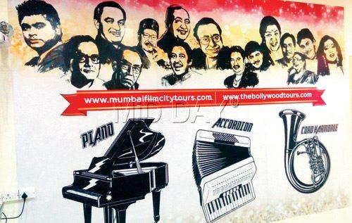 WALL OF FAME: The Bollywood singers’ caricatures in the tour introduction room