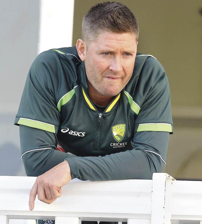 Australian captain Michael Clarke looks down from the pavilion balcony after England retained the Ashes on Day Three of the fourth Test at Trent Bridge yesterday