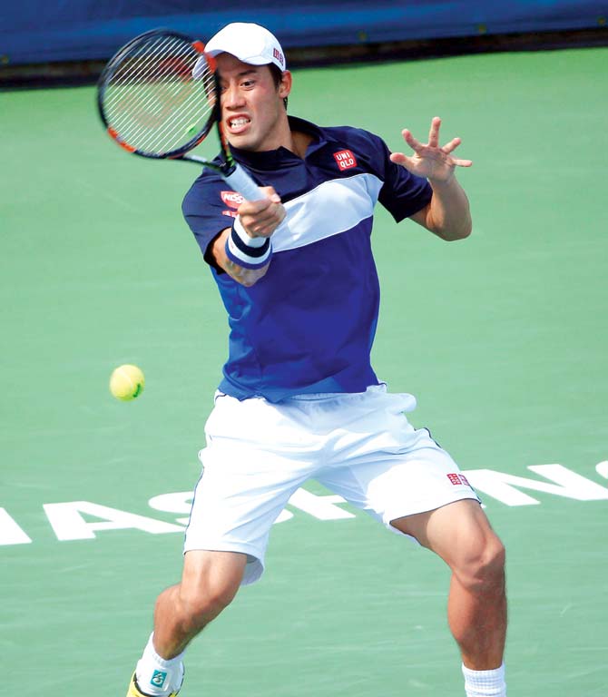 Kei Nishikori returns to Marin Cilic. Pic/AFP