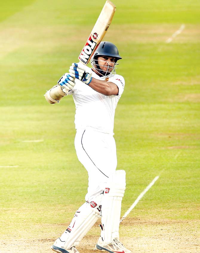Lankan Tiger: Kumar Sangakkara plays a leg-side shot off an England bowler en route his 147 at Lord