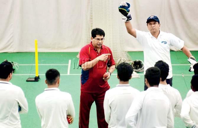 Chandrakant Pandit (left) talks to players while Kiran More watches during a camp for Mumbai wicketkeepers at the MCA indoor academy in Bandra Kurla Complex yesterday. Pic/Atul Kamble