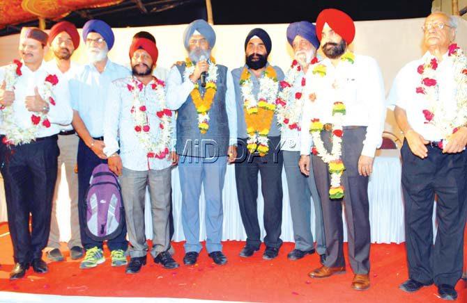 Mumbai Hockey Association secretary Ramsingh Rathore (third from left) and president Manga Singh Bakshi (third from right) after winning the elections at the MHA Stadium in Churchgate yesterday