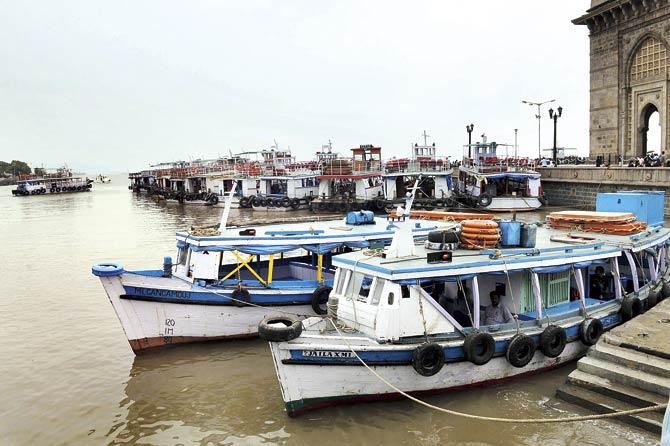 Boats headed to Elephanta anchored at the Gateway of India