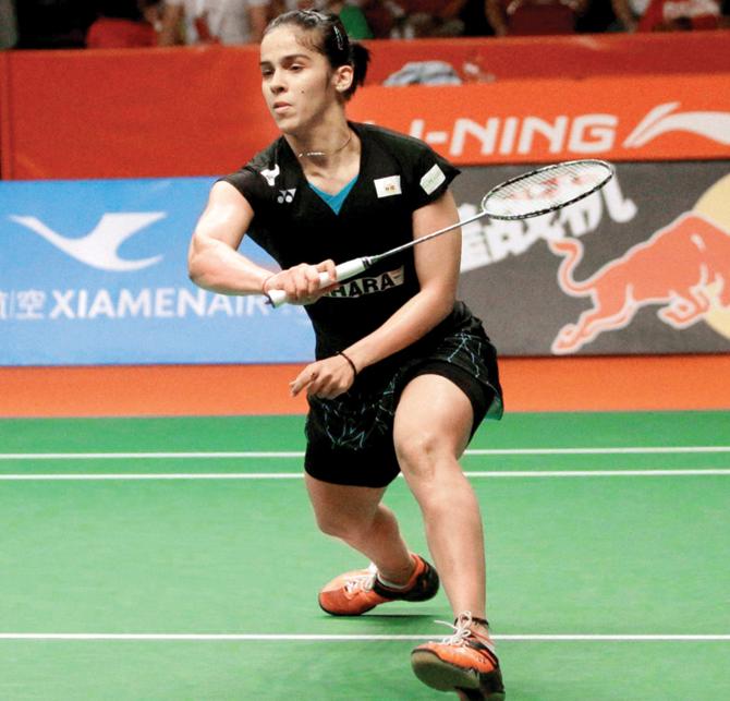 Saina Nehwal returns to Carolina Marin during their women’s singles final in Jakarta’s Istora Stadium yesterday. PIC:AP/PTI