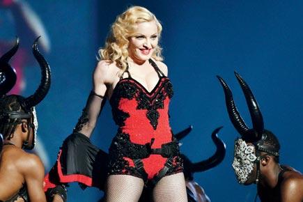 Madonna pulls down female fan's top at Brisbane concert