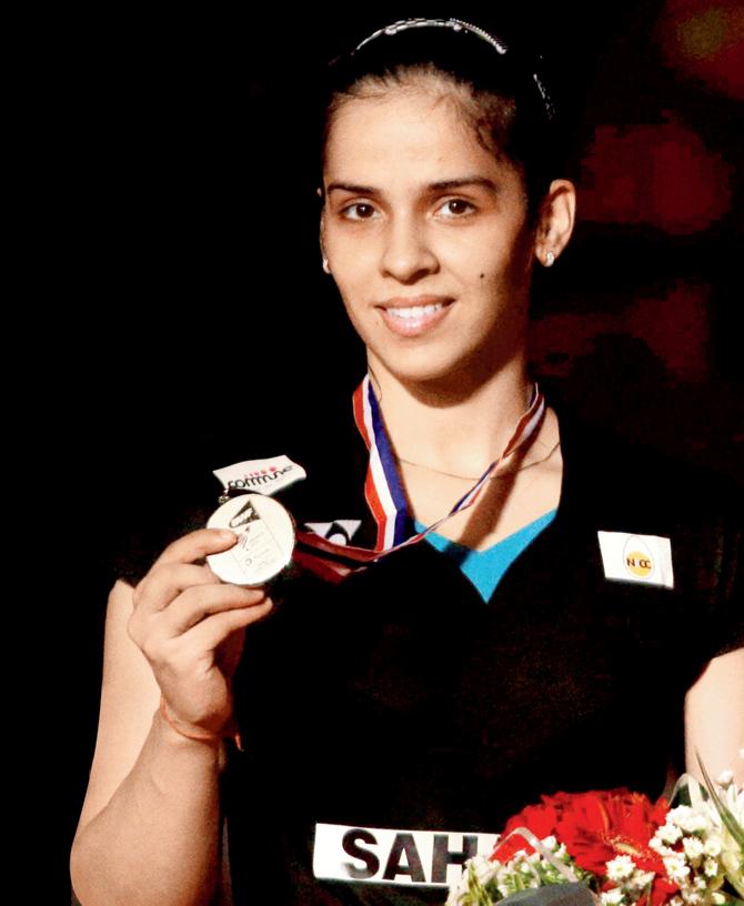 India’s Saina Nehwal poses with her silver medal at the BWF World Badminton Championships in Jakarta, Indonesia yesterday.