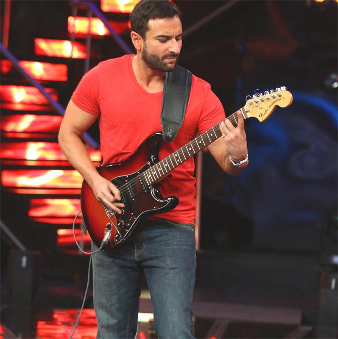 Saif Ali Khan playing guitar