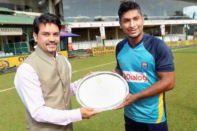 BCCI Secretary Anurag Thakur felicitating Sri Lankan batsman Kumar Sangakkara ahead of the second Test between Sri Lanka and India, which marks the farewell of the Sri Lankan legend in Colombo. Pic/PTI