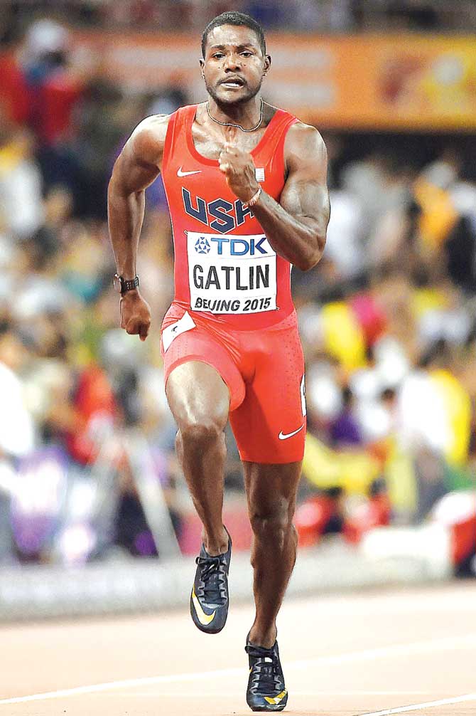 Justin Gatlin competes in the heats of the men