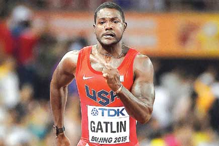 World Athletics Championships: Justin Gatlin ignores jeers to set up Usain Bolt encounter