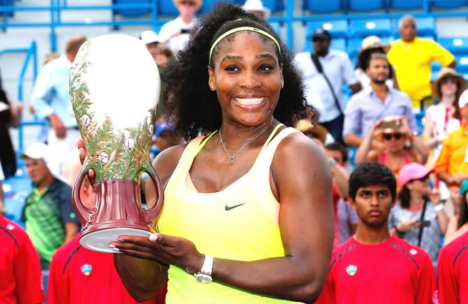 Serena Williams holds up the trophy after defeating Simona Halep of Romania to win the womens finals of the Western & Southern Open at the Linder Family Tennis Center  in Cincinnati. Pic/AFP