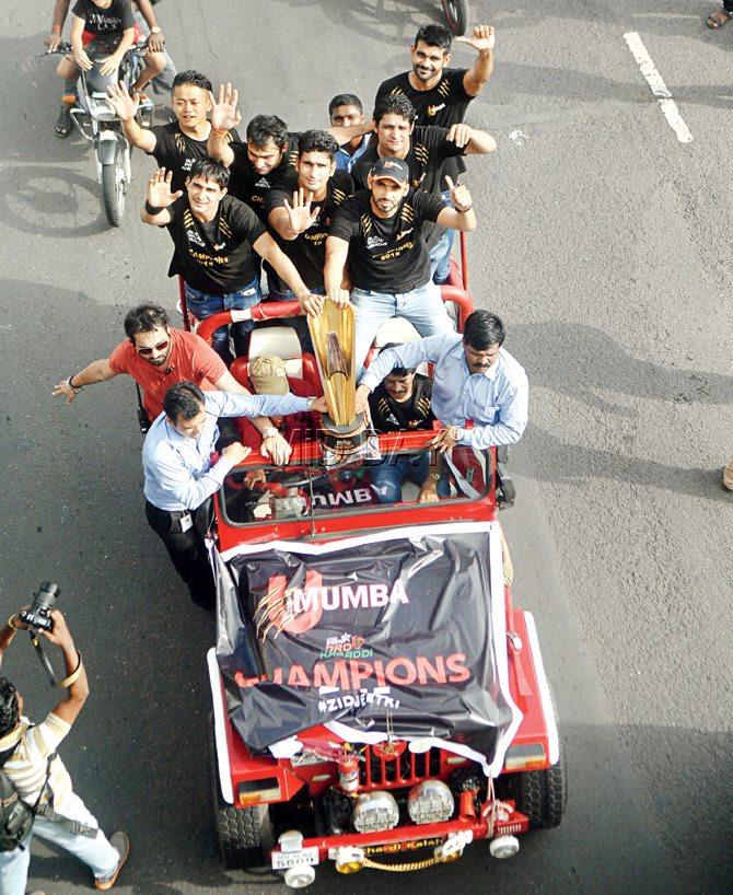 The U Mumba players in an open-top jeep at Marine Drive yesterday