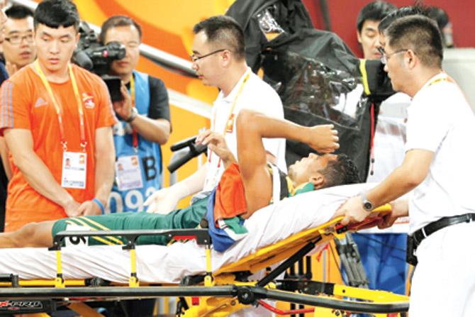 Wayde Van Niekerk is carried off the track after winning the men
