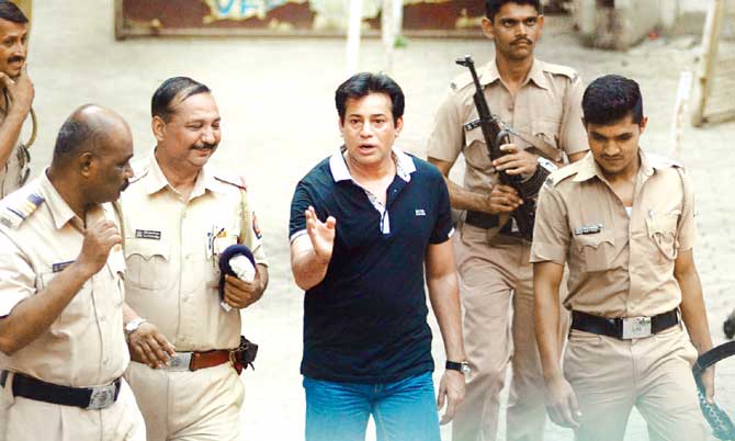 A file pic of Abu Salem being taken to court