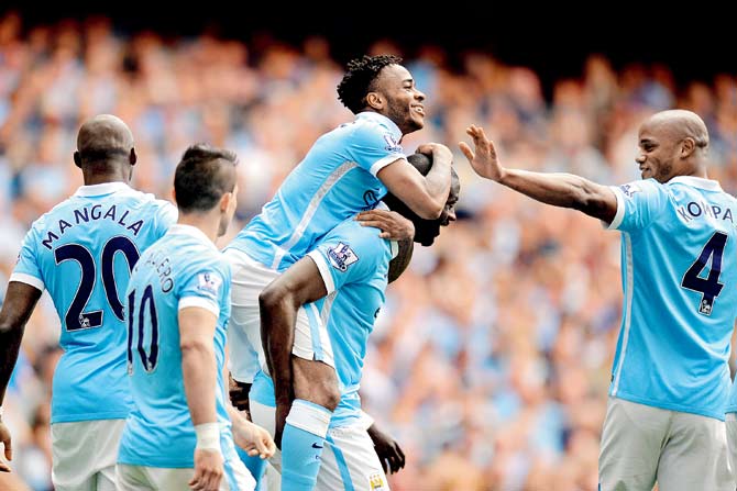 Manchester City’s (second from right) Raheem Sterling celebrates after scoring against Watford 