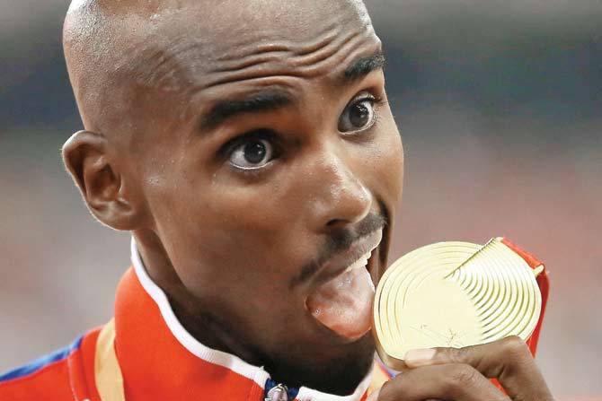 Great Britain’s Mo Farah poses with 5,000 metres gold medal. PIC/GETTY IMAGES