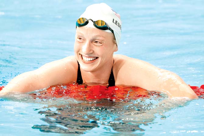 Katie Ledecky smiles after setting a new world record in the women