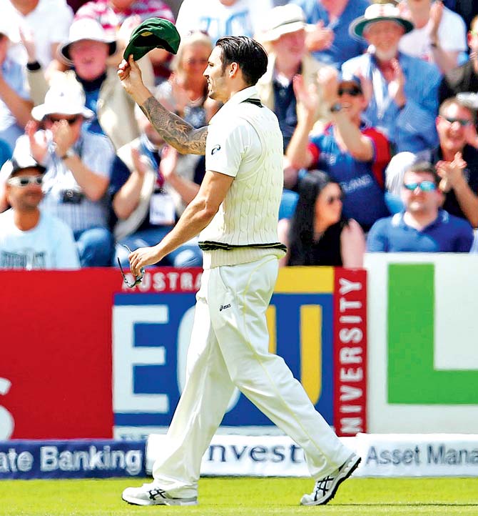 Australia pacer Mitchell Johnson doffs his cap after receiving a standing ovation from England fans for his worst-ever bowling figures of 0-111 during the first Ashes Test last month. Pic/Getty Images