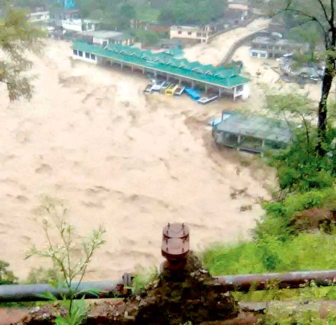 The submerged Dharampur bus station after a cloud burst in Mandi district of Himachal Pradesh on Saturday. Pic/PTI 