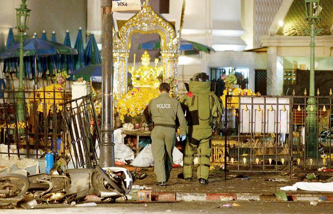 The fencing surrounding the Erawan shrine lay bent, following the impact of the blasts. The shrine is dedicated to Phra Phrom, who is the Thai representation of the Hindu God Brahma. PIC/pti