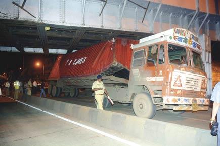 Container truck gets stuck below King's Circle bridge