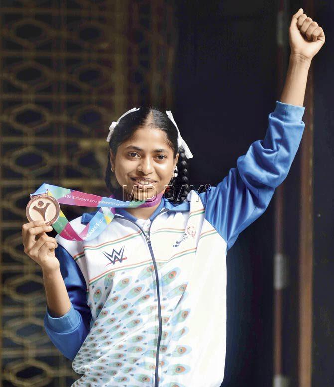 Fatima with her beloved bronze medal, which she has been inseparable from. Pics/Atul Kamble