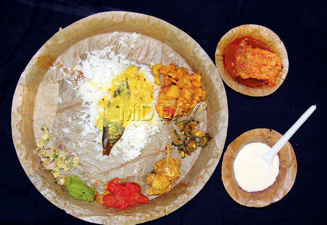 Dolly Singh’s thali featured (centre) white fluffy rice served with Moong Dal, (clockwise from top right) Chingri Phoolkopi Dalna, Karela Aloo Bhaja, Muri Ghonto, Tomato Chutney, Saag Chutney, Maach Makha and (in bowls, from top) Rohu Kalia and Payesh. Pic/Sharad Vegda
