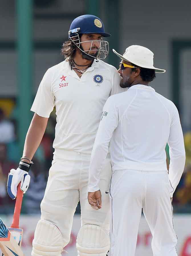 Sri Lankan cricketer Dinesh Chandimal right brushes past Ishant Sharma L during the fourth day of the third and final Test match between Sri Lanka and India at the Sinhalese Sports Club SSC in Colombo on Monday. 