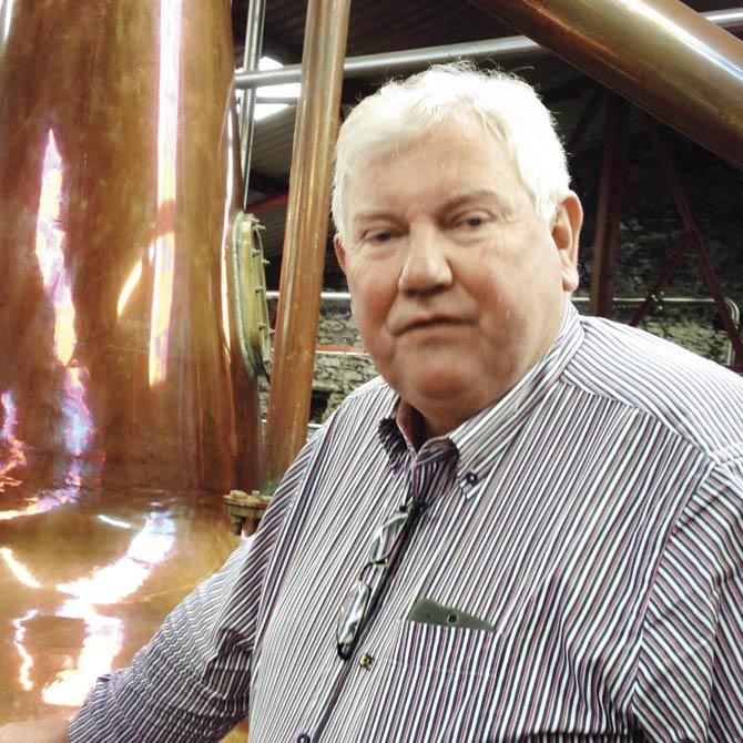 Guide Joe Joyce says water used in distilling was once drawn from a well below the property, with a now dysfunctional waterwheel