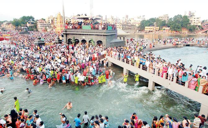 Lakhs of pilgrims take a dip at the start of the holy Kumbh Mela in Nashik on July 14, 2015. Pic/AFP
