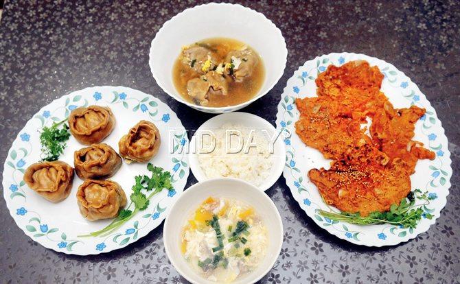A Korean fare by Hemi Baik: (clockwise from left) mandu or Korean dumplings; Manduguk, the dumpling soup; Kimchijeon, pan-fried pancakes; and the traditional Tteokguk, a broth cooked with rice cakes (in the centre)