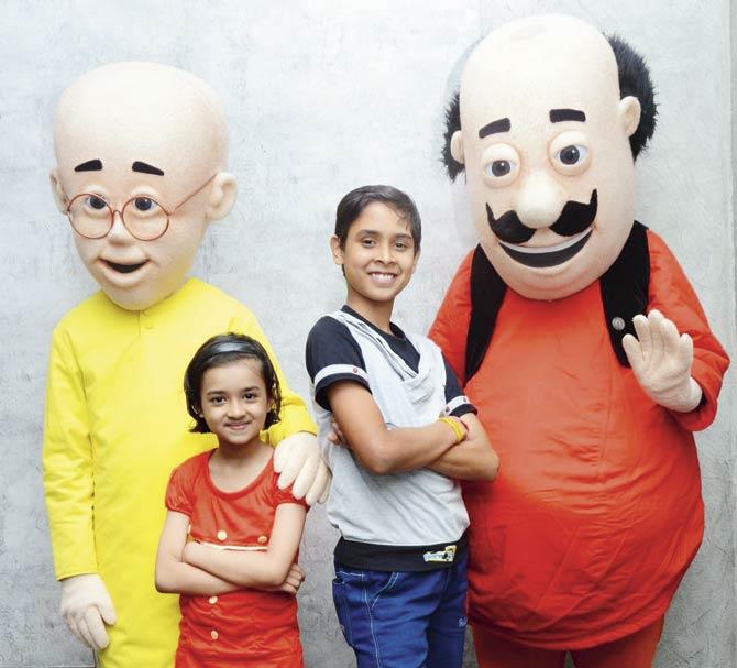(Left) Mansi Tiwari and Aakash Pandey at a photo shoot at a city animation studio