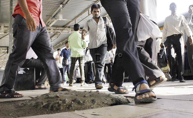 This cement mound at Marine Lines station causes at least two to three people to trip and fall on a daily basis. Railway cops said senior citizens and disabled people, in particular, face difficulties because of it. Pic/Tushar Satam