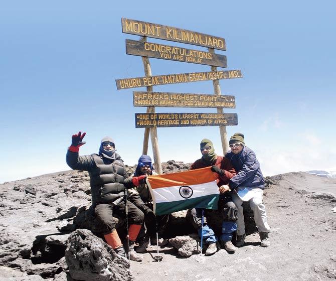 The team atop Mount Kilimanjaro