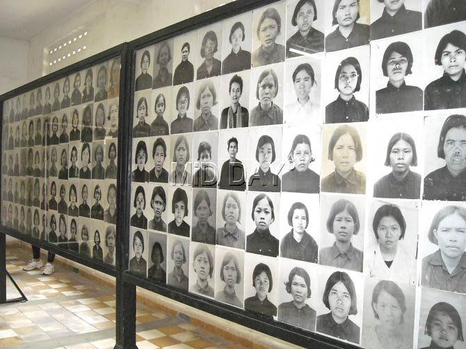 A row of photographs of prisoners at S-21 Prison, also known as the Tuol Sleng Museum of Genocide. As many as 30,000 prisoners were held here before being moved to the Killing Fields outside the city. The museum was meant to also preserve 6,000 black and white negatives as well as 20,000 pages of documentation concerning life in prison. However, the faces remain nameless since the dossiers matching their names went missing or were destroyed by the time this prison was discovered in January 1979. Pics/Fiona Fernandez
