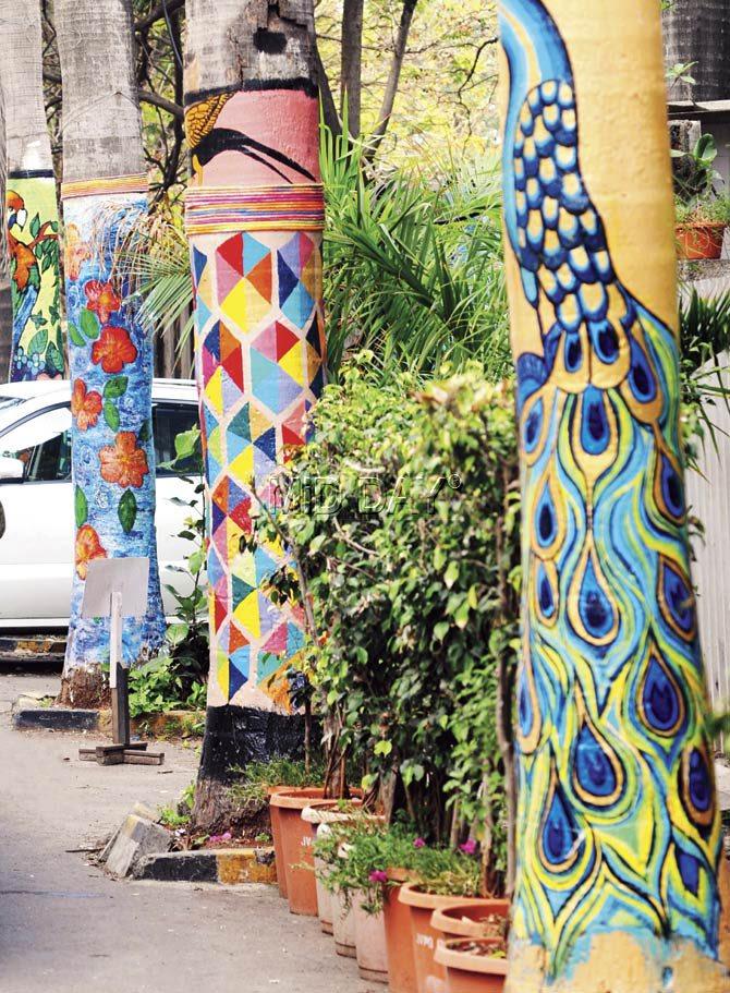 Three of the four trees painted by Rastaa Chaap outside Juhu Gym. Pics/Nimesh Dave