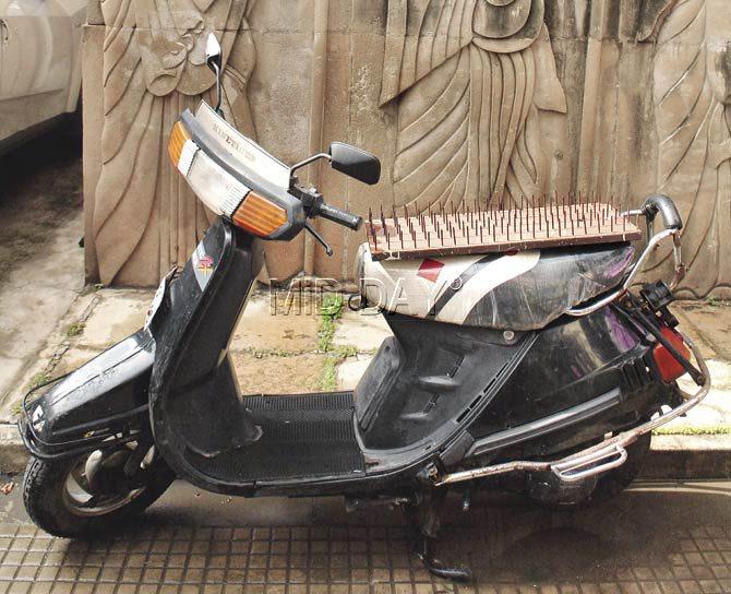 The owner of this scooter parked outside a fire temple in Tardeo seems to have found a novel way to keep vandals at bay. Pic/Shadab Khan