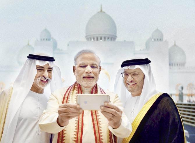 The sight of the PM taking selfies outside the Sheikh Zayed mosque was no doubt aimed at signalling that he runs a government committed to maintaining communal harmony, notwithstanding the party he represents. Pic/PTI