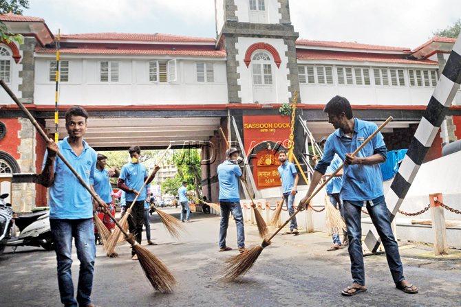 GETTING STARTED: Showing the way with the choice of weapon in hand, the jhadoo ki jhappi 