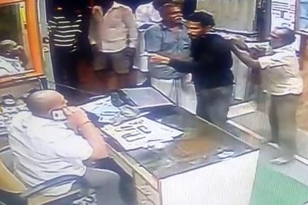 CCTV video: Brave man saves shopkeeper from deadly assault