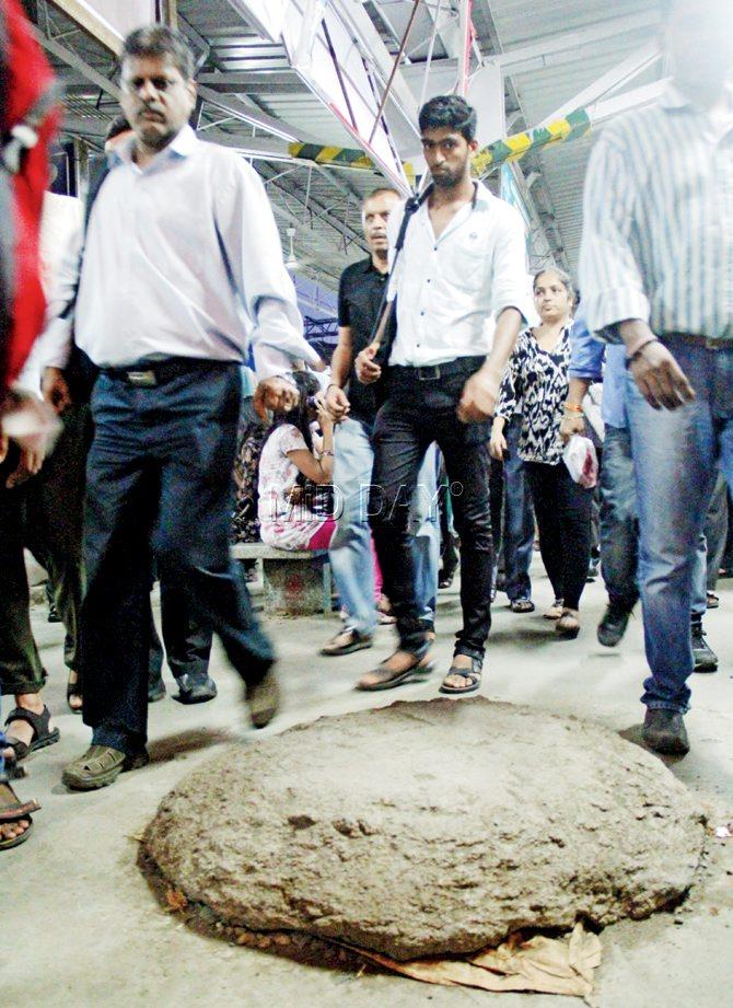 Commuters dodge the mound to avoid falling. Shirin said it must be removed as it poses a danger to commuters every day. Pics/Sharad Vegda