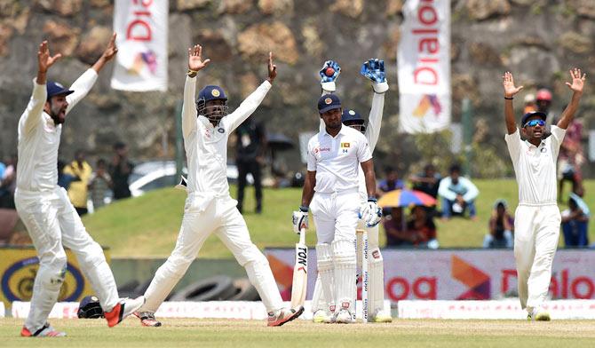 Indian cricketers successfully appeal against Sri Lankan cricketer Kumar Sangakkara (C)