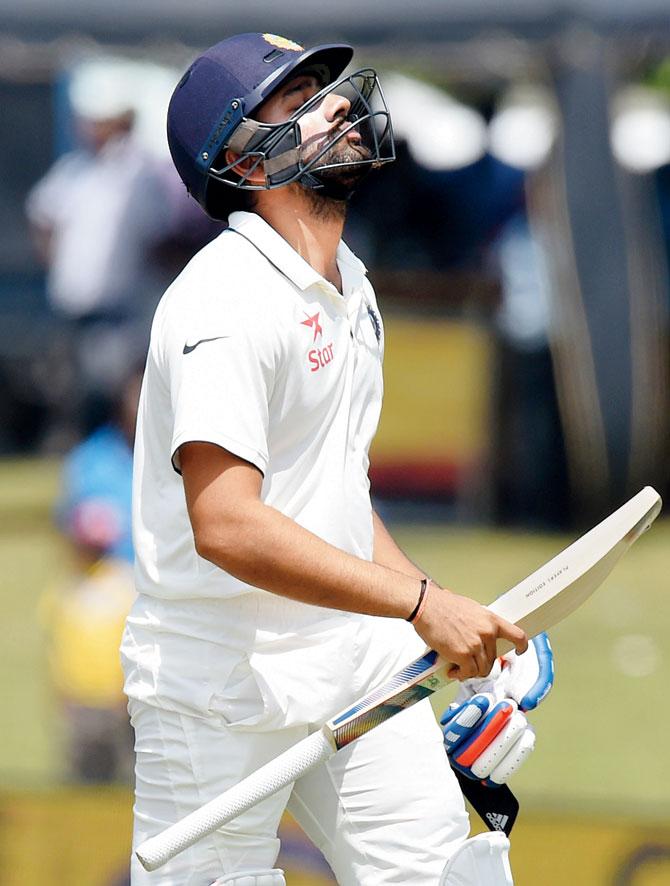 Rohit Sharma walks back after being out for four on Day 4 of the first Test vs Sri Lanka on Saturday. PIC/AFP