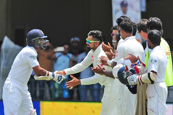 Kumar Sangakkara being congratulated by Team India